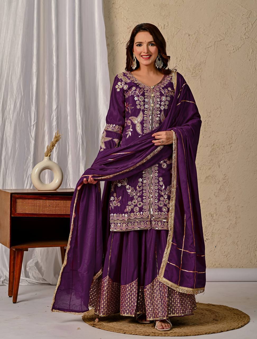 Regal Wine Purple Kurti and Flared Palazzo Suit Set Embellished with Intricate Floral Zari and Mirror Work